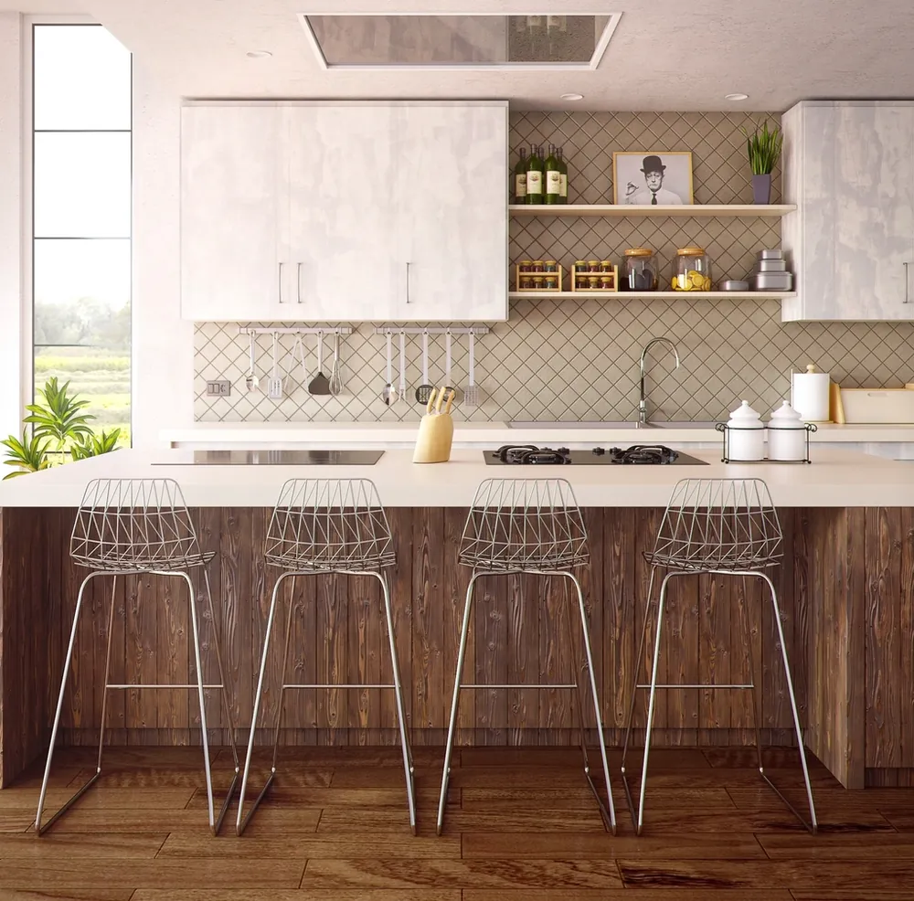 Bright kitchen with white cabinets, island and wire bar stools