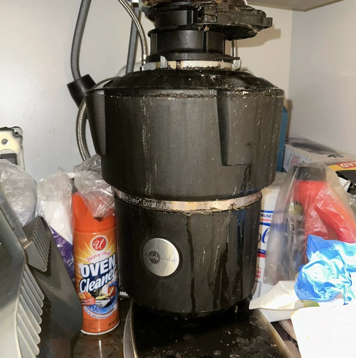 Garbage disposal unit installed under a kitchen sink